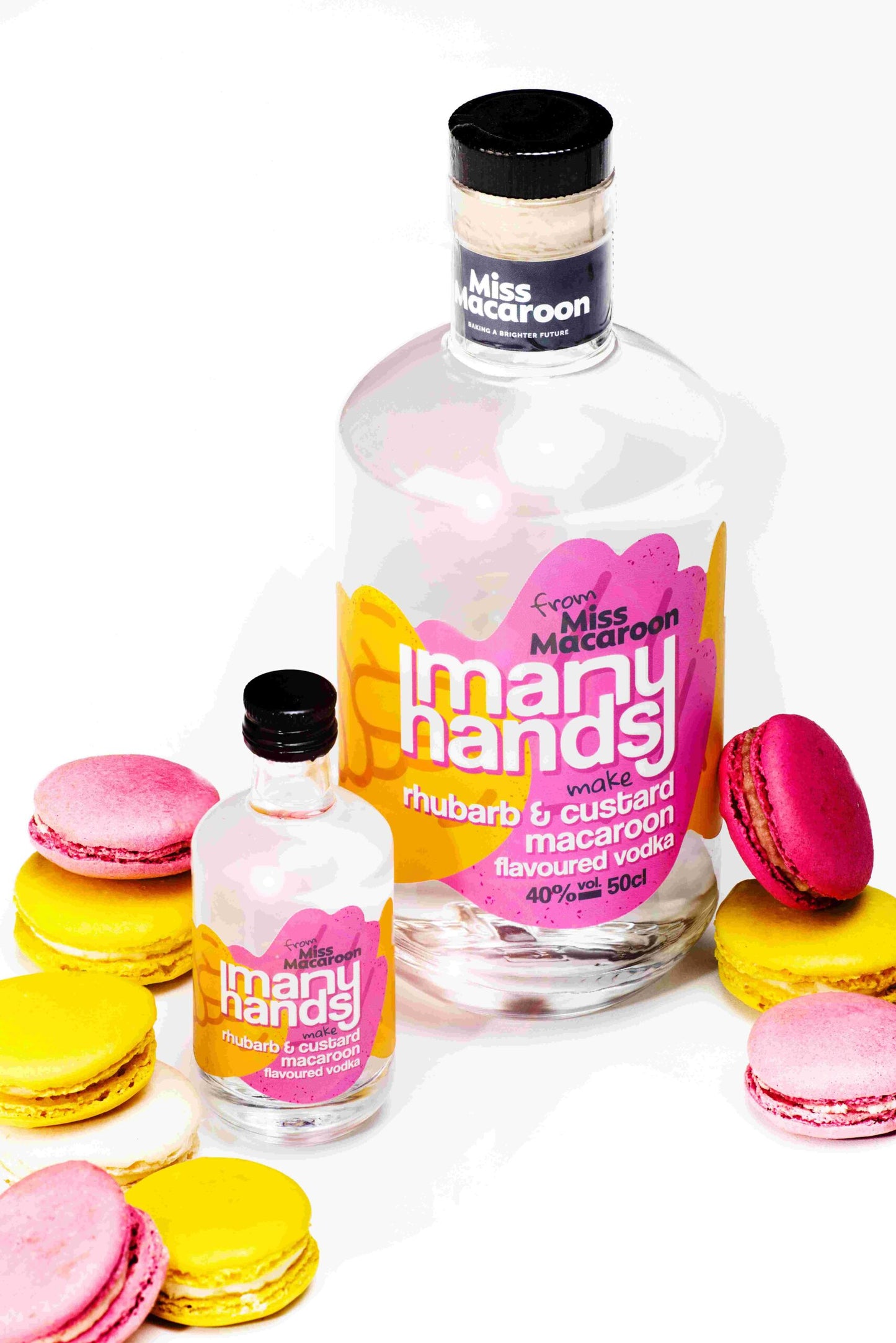 500ml and 50ml Many Hands Make Rhubarb & Custard macaroon flavoured vodka. Yellow and pink coloured label. With Rhubarb & Custard macaroons