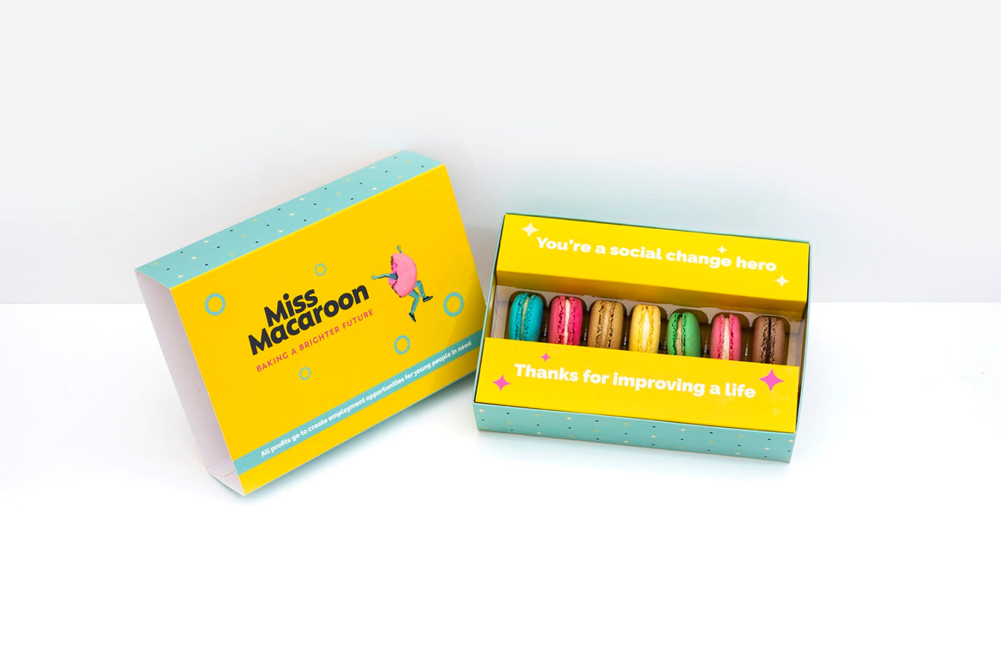 Gift box of seven macaroons. One of each flavour, seven different bright coloured macaroons.