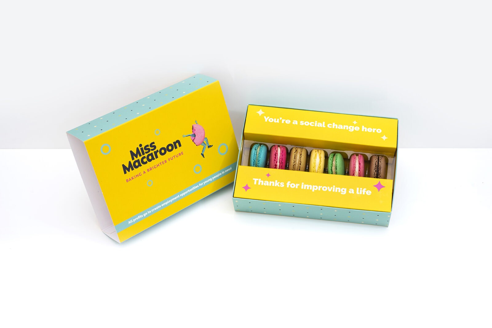 Gift box of seven macaroons. One of each flavour, seven different bright coloured macaroons.