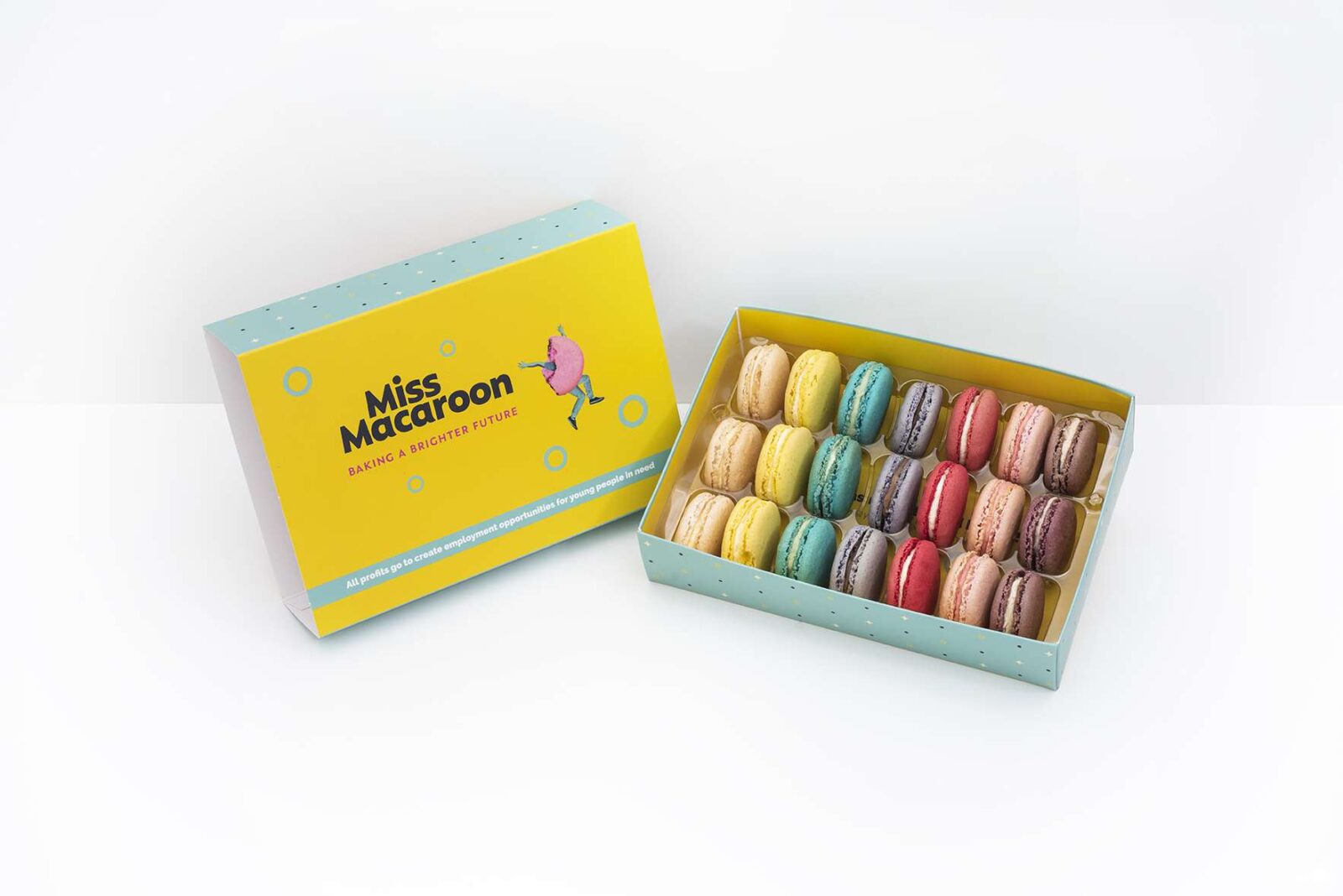 A yellow box of macaroon displaying 6 different coloured macaroons each represented by 3 macaroons